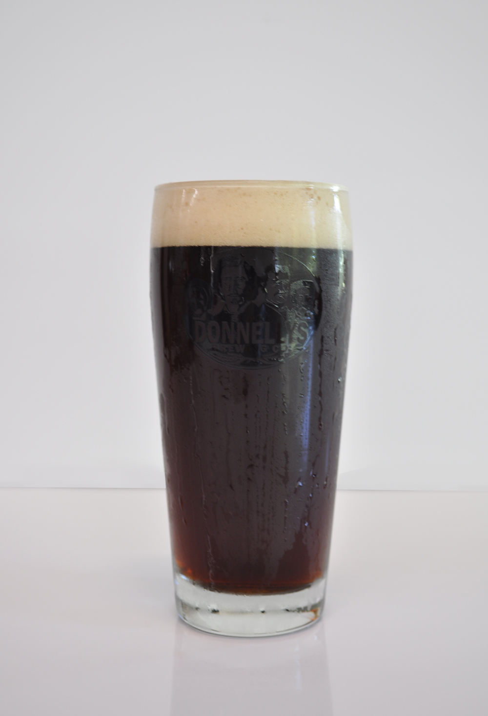 A refreshing pint of Black Donnellys Brewing Company Roman Line Lager beer.